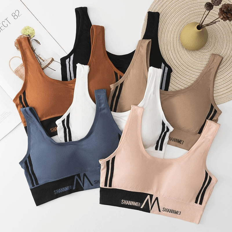 Colorful assortment of seamless sports bras with lining, perfect for women in gym workouts, yoga, and running. Comfortable and breathable.